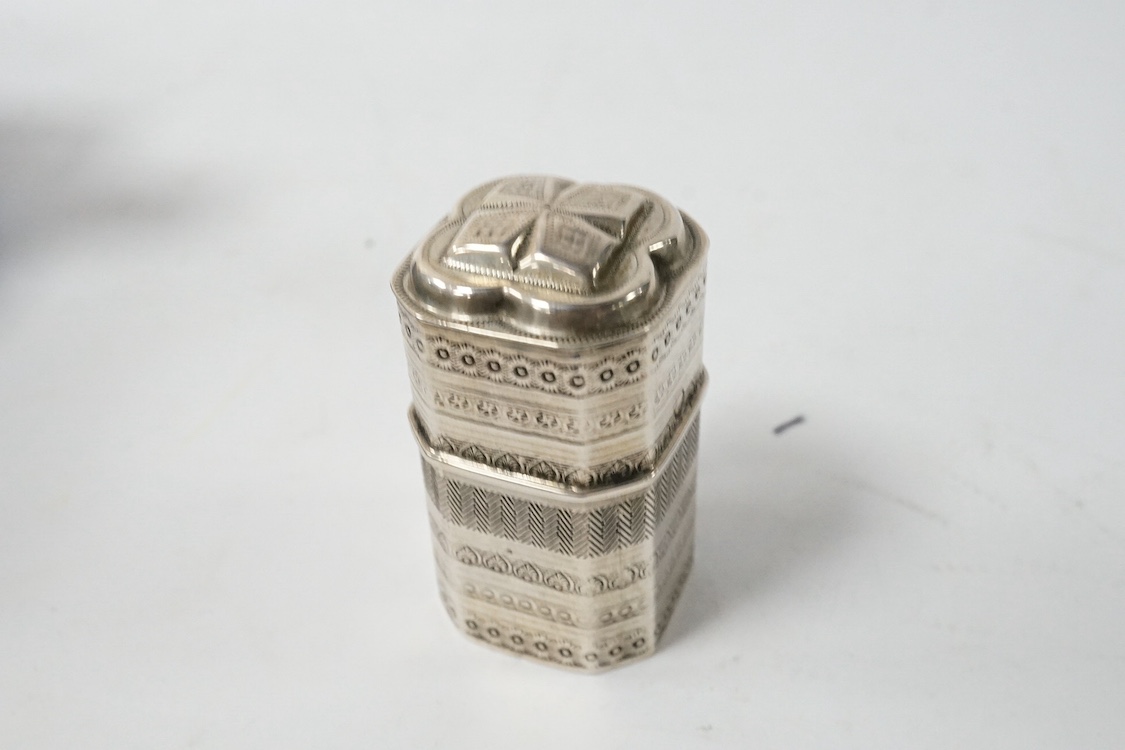 A 19th century Dutch white metal octagonal vinaigrette, with engraved geometric decoration, 51mm, together with two William IV silver mounted glass toilet jars, George Reid, London, 1834, one other later silver mounted g